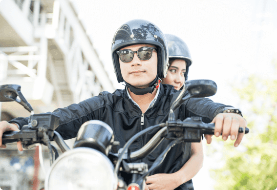 a couple of men riding a motorcycle