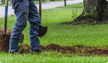 a person shoveling dirt