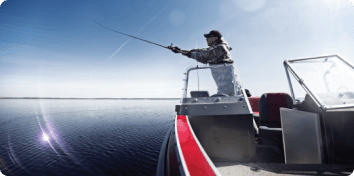 a man fishing off a boat