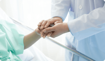 a doctor holding a patient's hand