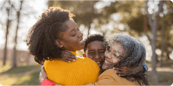 three people hugging