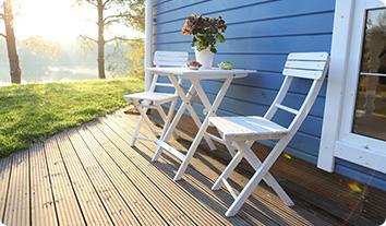 a table and chairs on a deck