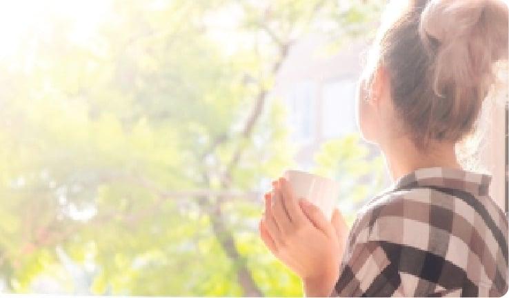 a man holding a cup