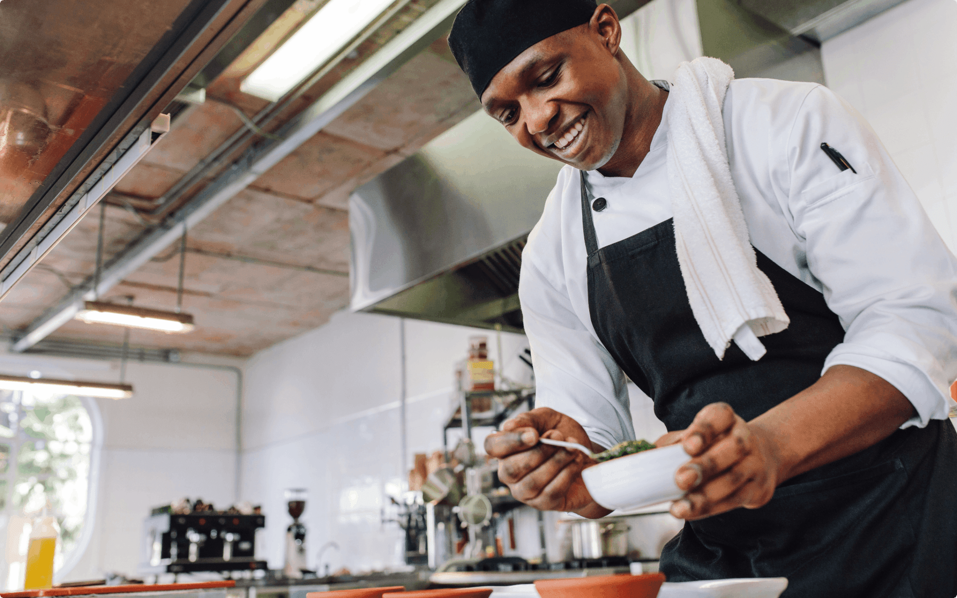 A chef preparing meals in their restaurant.