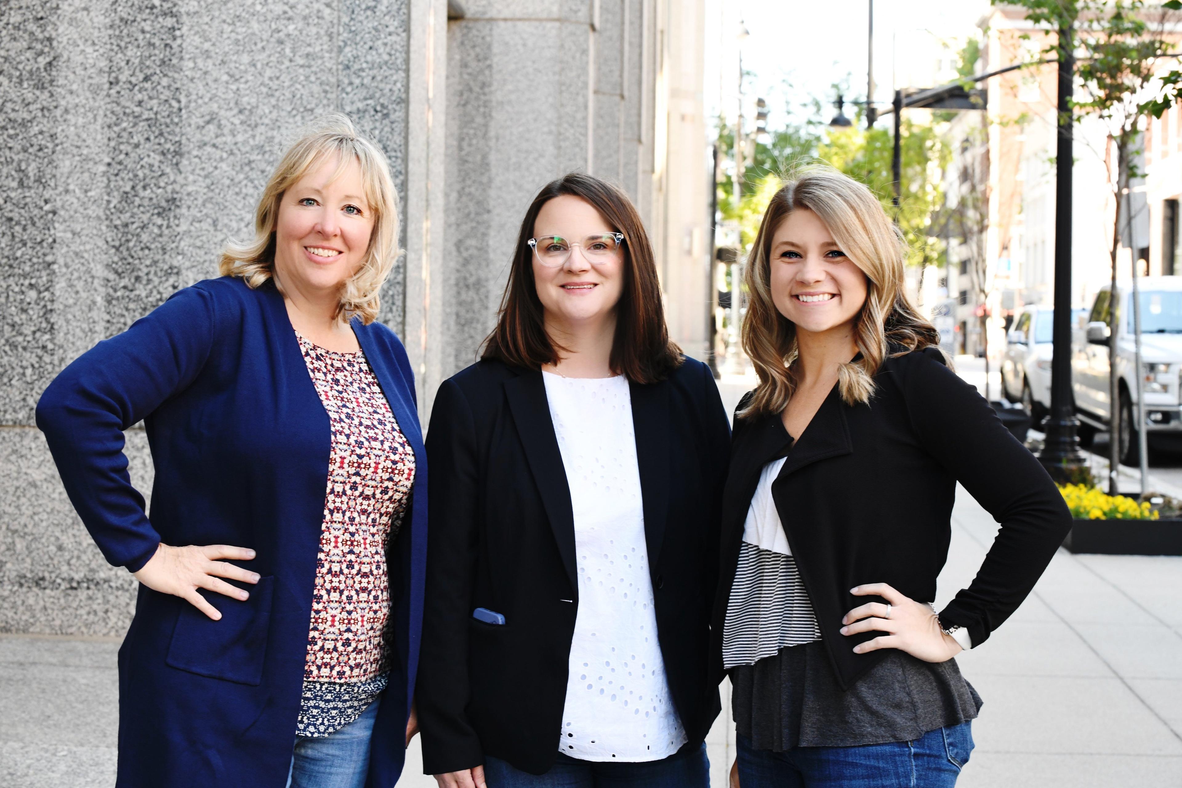 a group of women posing for a photo