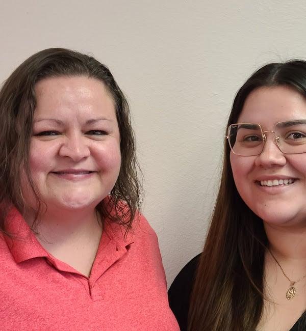 a couple of women smiling