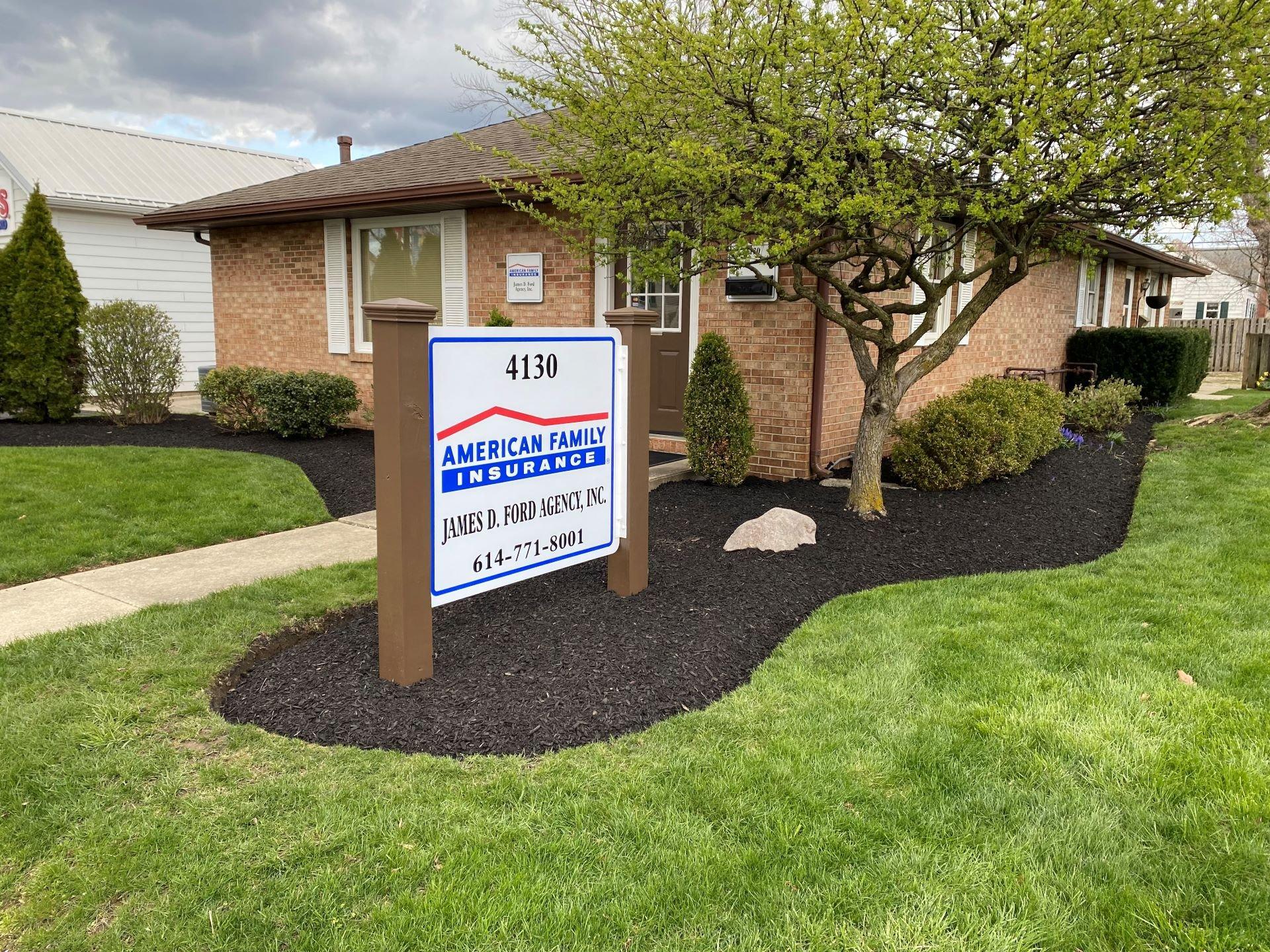 a sign in front of a house