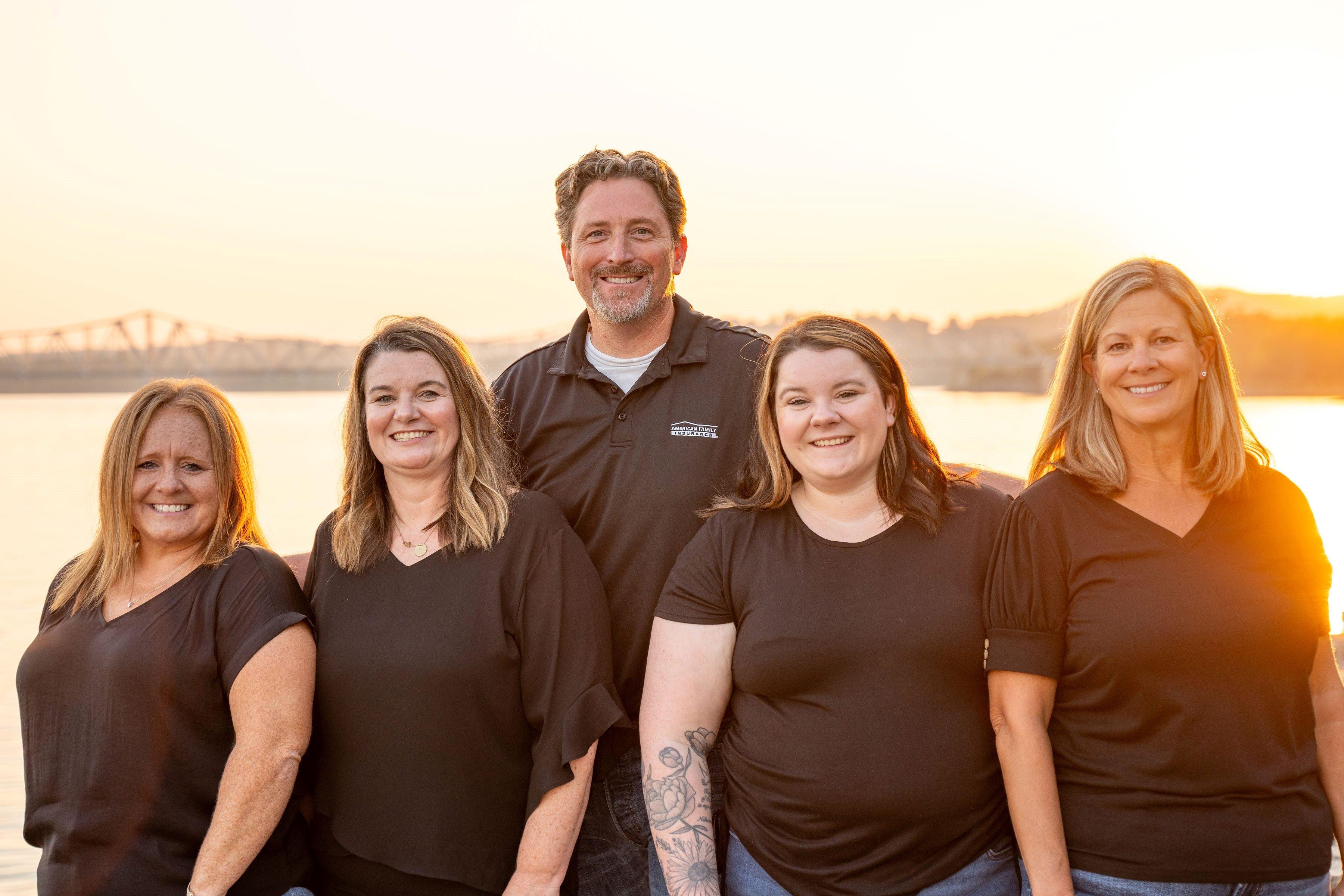 a group of people posing for a photo