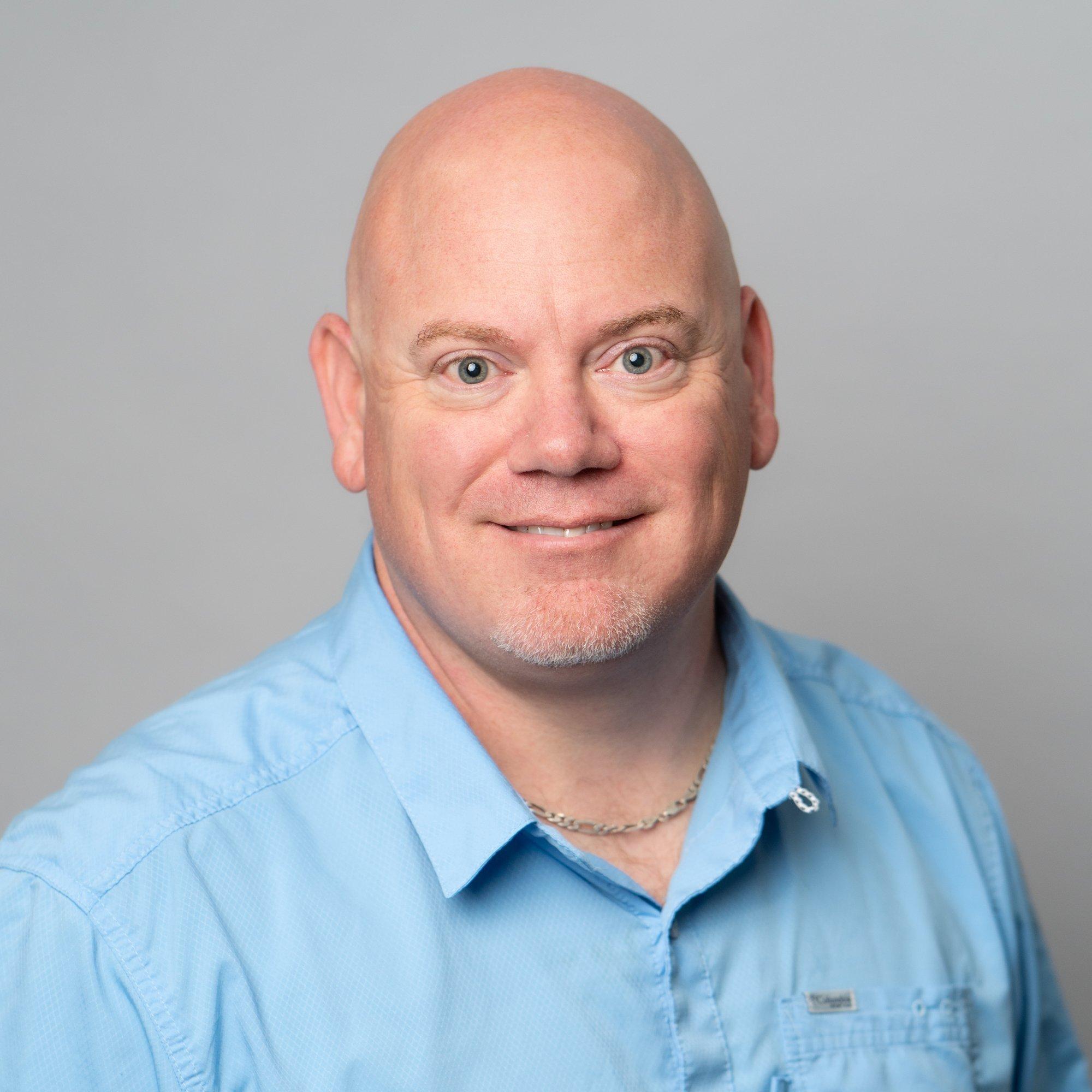 a man in a blue shirt