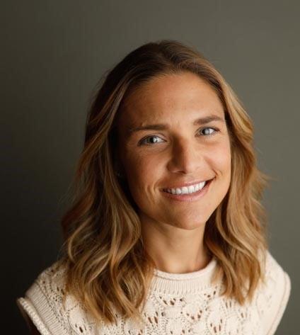 a close-up of a woman smiling