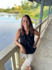 a woman standing on a bridge