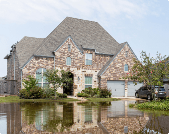 A home surrounded by street-flooding.