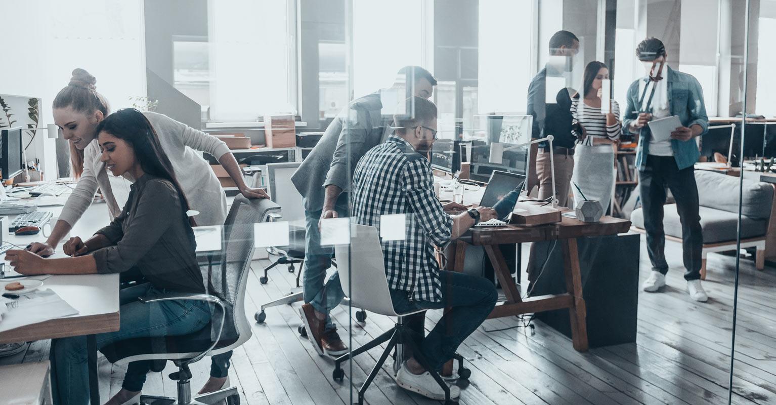 Young workers at business on computers preventing cyber crime. 