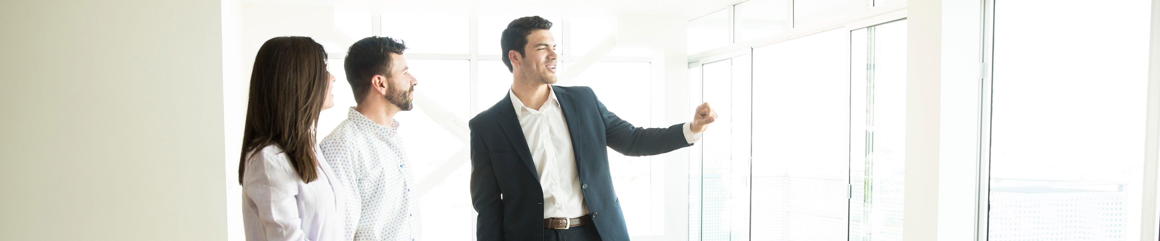 Image of a landlord showing prospective tenants a rental property.