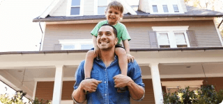 a person holding a baby on the shoulders