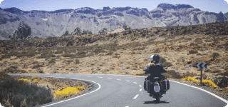 a person riding a motorcycle on a road