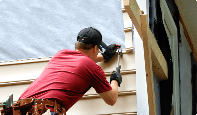 siding being placed on home